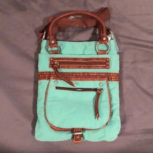 Brand New with tags Turquoise crossbody purse.